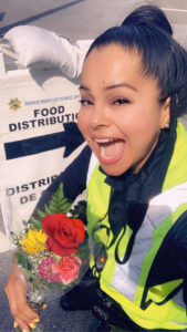 A grateful community member brought flowers to Officer Zorie Gomez, in appreciation of Officer Gomez’ cheerful and helpful disposition every week at the entrance of the District Emergency Food Distribution event.